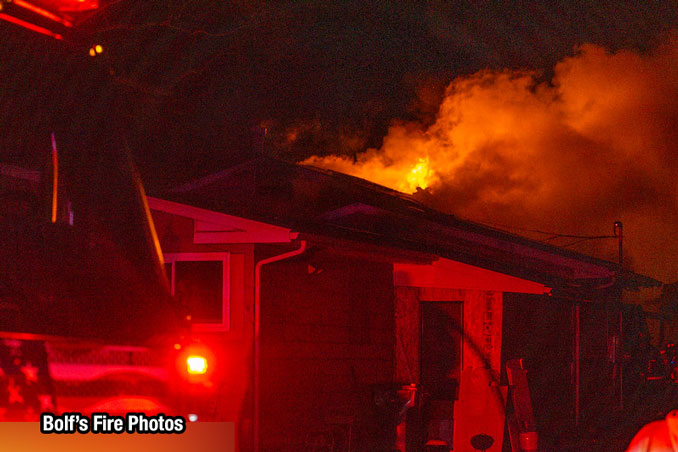 Fire from the roof a house on Twin Lakes Boulevard in Wildwood on Wednesday evening, December 13, 2023 (PHOTO CREDIT: Jimmy Bolf)