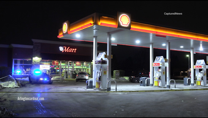 Police investigation of  white Infiniti parked at the Shell gas station at River Road and Euclid Avenue in Mount Prospect (CARDINAL NEWS)