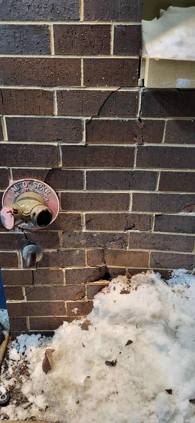 Brick damage near Automatic Sprinkler connection for the fire department (PHOTO CREDIT: Chris Kobler)