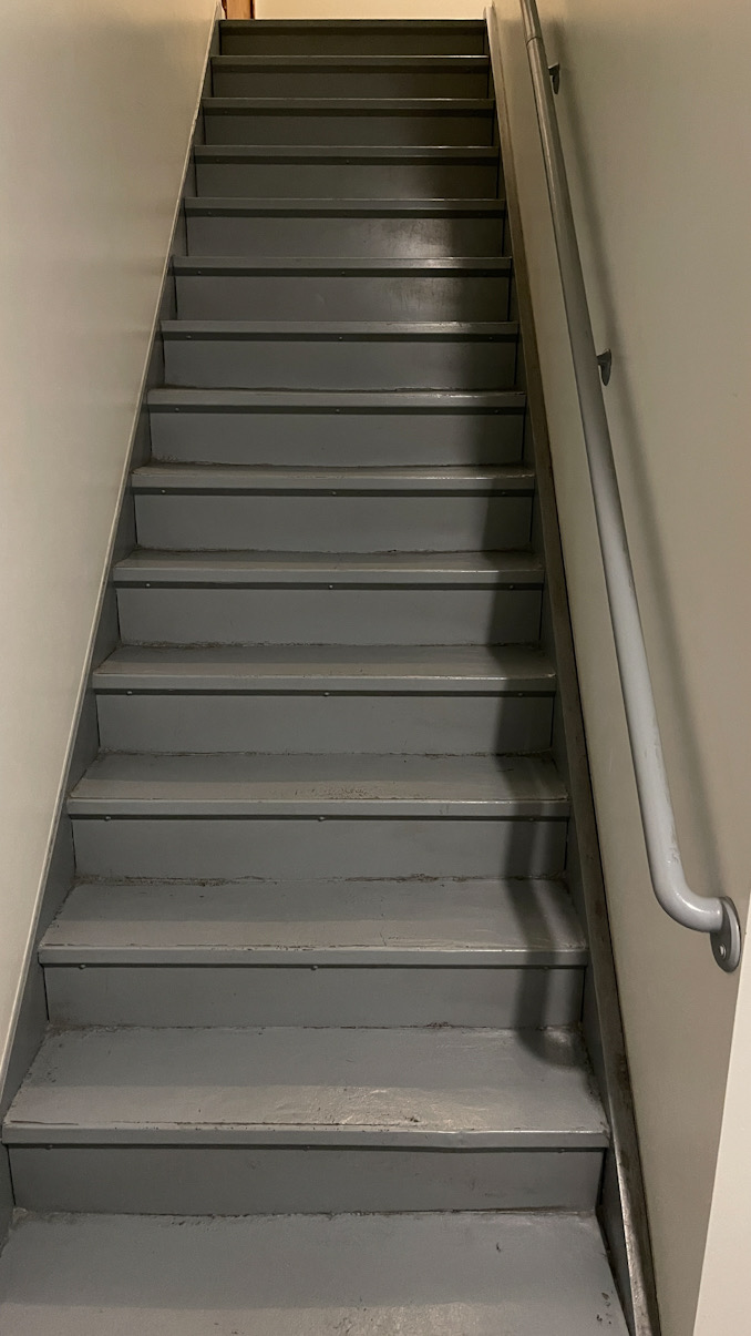 Stairs to the second floor at 2700 Bel Aire Drive in Arlington Heights (CARDINAL NEWS)