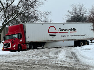 A semi-trailer truck slid off King Street south of Lee Street and sits blocking King Street in Elk Grove Village at about 12:54 p.m. Friday, January 12, 2024 (CARDINAL NEWS)