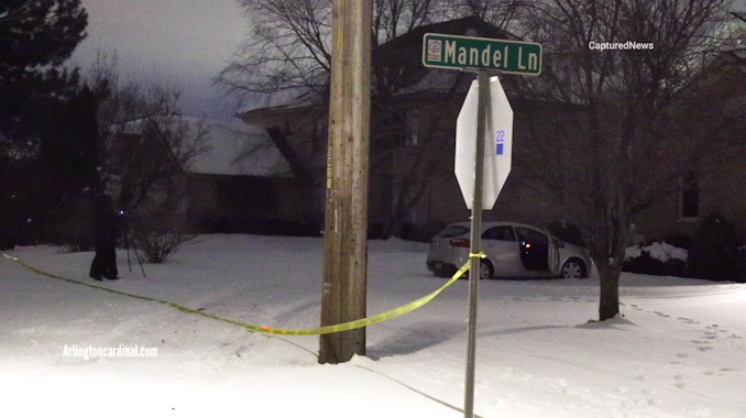Crime scene tape at the crash scene near Camp McDonald Road and Mandel Lane where a crashed gray Kia Soul was located on the lawn during investigation early Monday morning January 22, 2024 (CARDINAL NEWS)