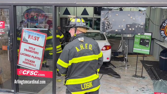 Firefighters planning vehicle removal at 118 East Wing Street on Tuesday, January 30, 2024 (CARDINAL NEWS)