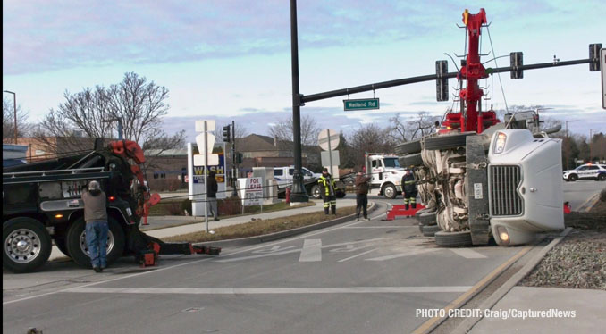 Scene of a rollover semi-trailer dump truck crash at Weiland Road and Aptakisic Road in Buffalo Grove, Thursday, January 4, 2024 (PHOTO CREDIT: Craig/CapturedNews)