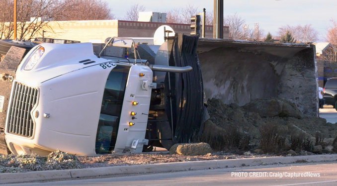 Scene of a rollover semi-trailer dump truck crash at Weiland Road and Aptakisic Road in Buffalo Grove, Thursday, January 4, 2024 (PHOTO CREDIT: Craig/CapturedNews)