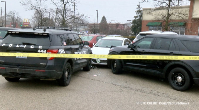 Waukegan police investigating a scene where a female struck a police officer while she was allegedly driving a stolen vehicle and allegedly under the influence of drugs with a passenger that tried to flee on foot (PHOTO CREDIT: Craig/CapturedNews).