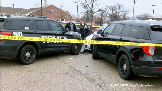 Waukegan police investigating a scene where a female struck a police officer while she was allegedly driving a stolen vehicle and allegedly under the influence of drugs with a passenger that tried to flee on foot (PHOTO CREDIT: Craig/CapturedNews).