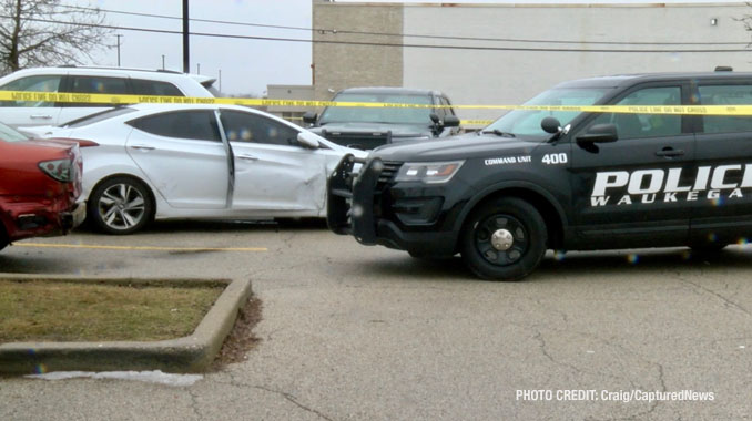 Waukegan police investigating a scene where a female struck a police officer while she was allegedly driving a stolen vehicle and allegedly under the influence of drugs with a passenger that tried to flee on foot (PHOTO CREDIT: Craig/CapturedNews).