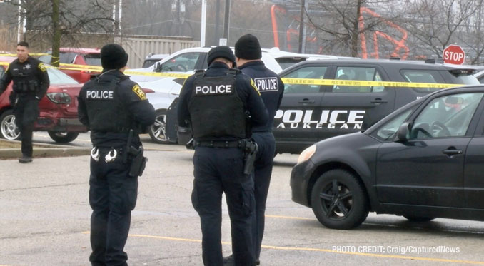 Waukegan police investigating a scene where a female struck a police officer while she was allegedly driving a stolen vehicle and while allegedly under the influence of drugs, along with a passenger that tried to flee on foot (PHOTO CREDIT: Craig/CapturedNews)
