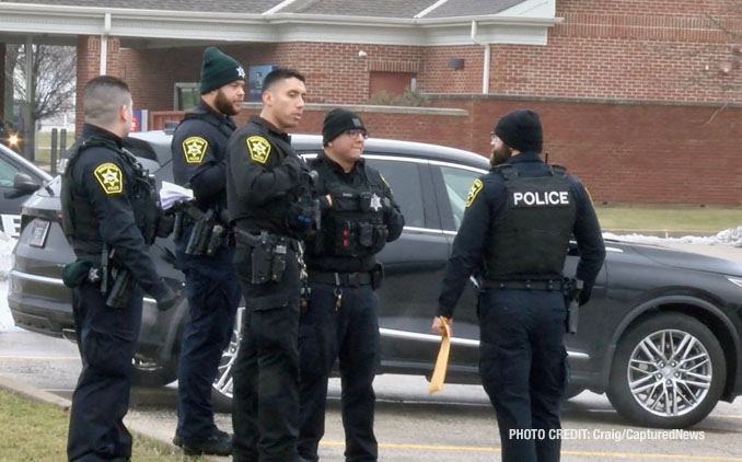 Waukegan police investigating a scene where a female struck a police officer while she was allegedly driving a stolen vehicle and allegedly under the influence of drugs with a passenger that tried to flee on foot (PHOTO CREDIT: Craig/CapturedNews).