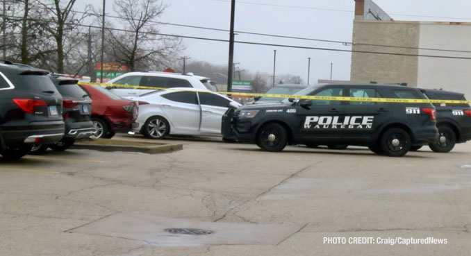 Waukegan police investigating a scene where a female struck a police officer while she was allegedly driving a stolen vehicle and while allegedly under the influence of drugs, along with a passenger that tried to flee on foot (PHOTO CREDIT: Craig/CapturedNews).