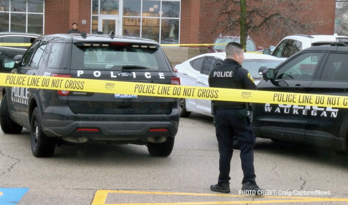 Waukegan police investigating a scene where a female struck a police officer while she was allegedly driving a stolen vehicle and allegedly under the influence of drugs with a passenger that tried to flee on foot (PHOTO CREDIT: Craig/CapturedNews)