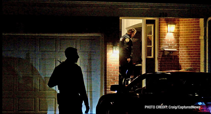 Police officers from Barrington enter a second townhouse unit, part of a stabbing investigation Monday night, February 19, 2024 on Walton Street in Barrington (Craig/CapturedNews)