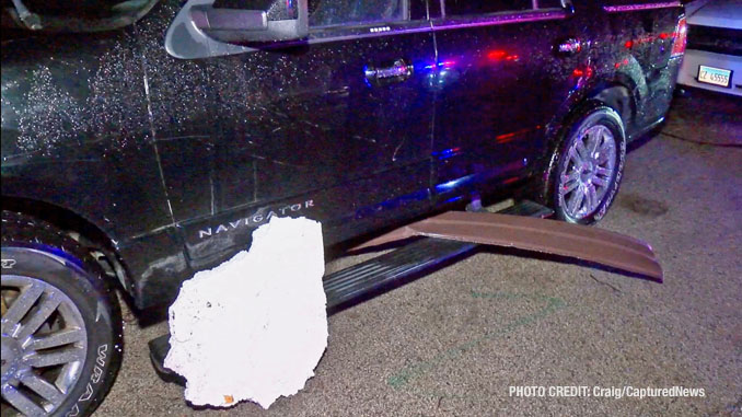 Building debris from storm damage next to an SUV at Washington Apartments in Mundelein on Tuesday, February 27, 2024 (Craig/CapturedNews)