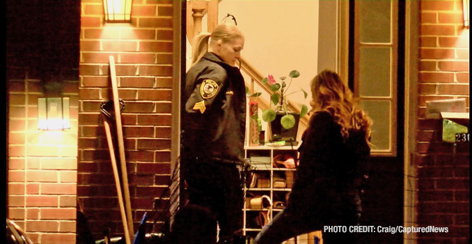 Police officers from Barrington investigate the interior of one of two townhouse units that were part of a stabbing investigation Monday night, February 19, 2024 (Craig/CapturedNews)