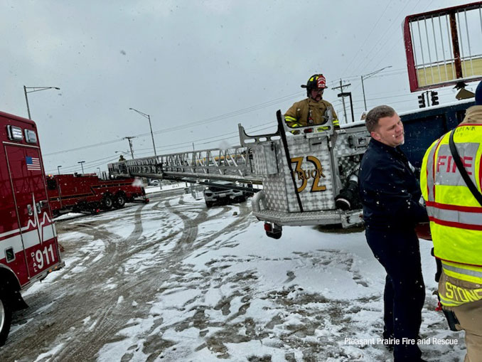 Construction worker in a Stokes basket on a Pleasant Prairie Fire & Rescue Tower Ladder Truck 32 during a rooftop rescue Friday, March 22, 2024 (SOURCE: Pleasant Prairie Fire & Rescue)