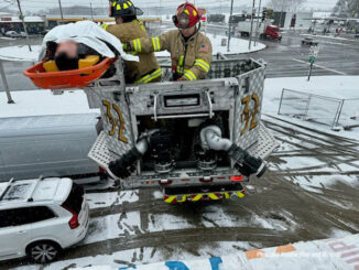 Construction worker in a Stokes basket on a Pleasant Prairie Fire & Rescue Tower Ladder Truck 32 during a rooftop rescue Friday, March 22, 2024