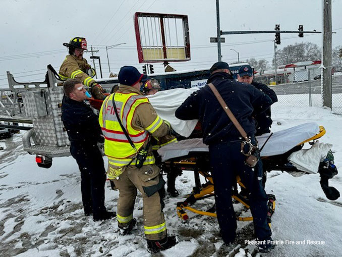 Construction worker in a Stokes basket on a Pleasant Prairie Fire & Rescue Tower Ladder Truck 32 during a rooftop rescue Friday, March 22, 2024 (SOURCE: Pleasant Prairie Fire & Rescue)