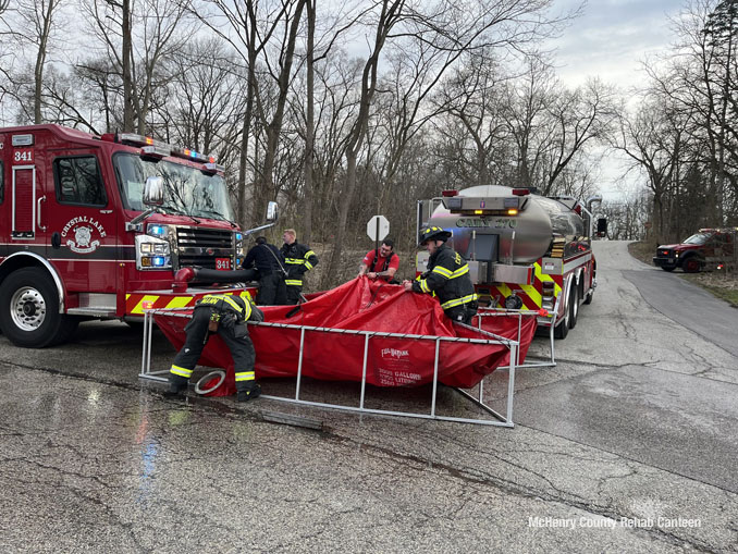 Portable water tank at Riverside Drive and Tulip Street near a house fire scene in unincorporated Crystal Lake on Friday, March 29, 2024 (SOURCE: McHenry County Rehab Canteen)