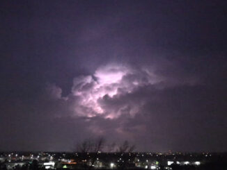 Lightning illuminates cumulus cloud tops in a thunderstorm about 24 miles away near Marengo and Algonquin, Illinois (CARDINAL NEWS)