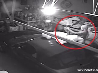 Criminal intruder prepared with a gun pointed at interior garagare door into the living space of the home; consider the surprise and level of alertness that a recently sleeping homeowner might have when opening their door to an alert, awake offender already pointing a gun at the door for cover while another offender is rummaging the door for valuables (SOURCE: Prospect Heights Police Department)