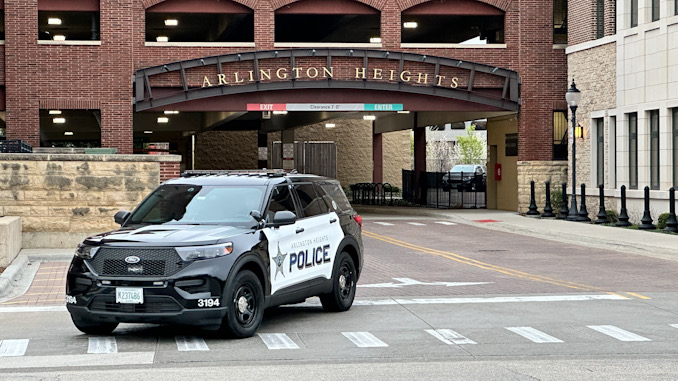 New black-and-white Arlington Heights police SUV leaving the Arlington Heights Police Station Thursday, April 11, 2024 (CARDINAL NEWS)