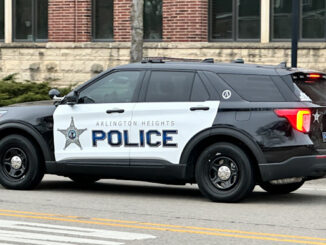 New black-and-white Arlington Heights police SUV leaving the Arlington Heights Police Station Thursday, April 11, 2024 (CARDINAL NEWS)