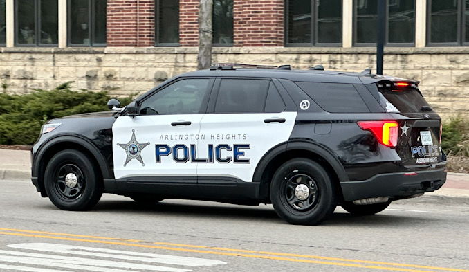 New black-and-white Arlington Heights police SUV leaving the Arlington Heights Police Station Thursday, April 11, 2024 (CARDINAL NEWS)