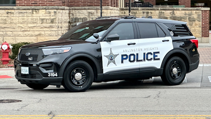 New black-and-white Arlington Heights police SUV leaving the Arlington Heights Police Station Thursday, April 11, 2024 (CARDINAL NEWS)