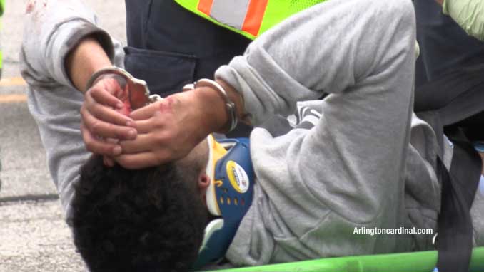 Crash victim from a black Honda CRV lying in the street while assessed and treated by paramedics after a crash on Thursday morning, May 9, 2024 (CARDINAL NEWS)