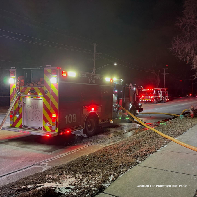 Firefighters working to extinguish a detached garage approximately 10vehicle carport in Bensenville in sub freezing temperatures Friday night January 24, 2025 (PHOTO CREDIT: Addison Fire Protection District)