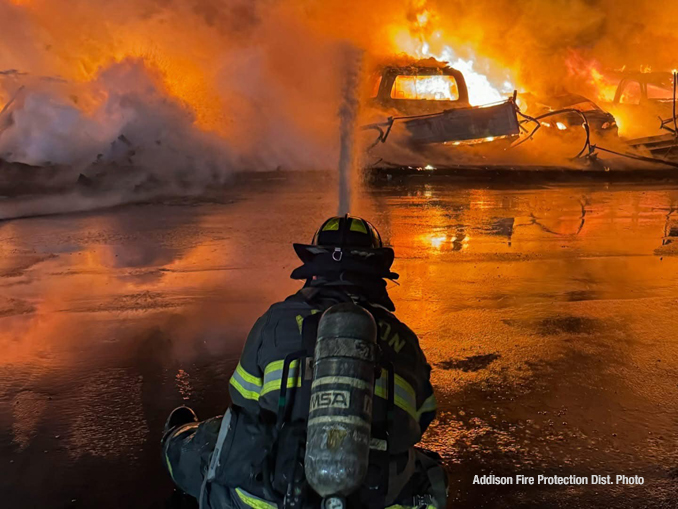 Firefighters working to extinguish a detached garage approximately 10vehicle carport in Bensenville in sub freezing temperatures Friday night January 24, 2025 (PHOTO CREDIT: Addison Fire Protection District)