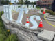 A vehicle ramming crash damaged the flagstone sitting wall under the letter 'T' and 'S' Tuesday, July 29, 2025 (CARDINAL NEWS)