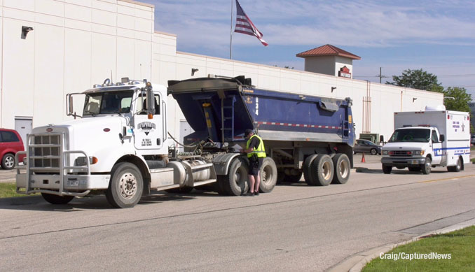 White and blue Peterbilt  semi-trailer dump truck after a fatal crash with a motorcyclist on Friday afternoon, July 18, 2025 (SOURCE: Craig/Captured News)
