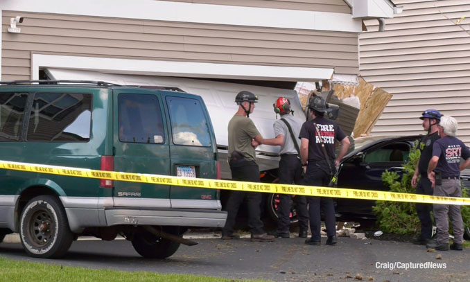 Fire department technical rescue and stabilization experts at the scene of a car crash into a garage on Kessler Drive in Mundelein, Saturday evening, July 19, 2025 (Craig/CapturedNews)