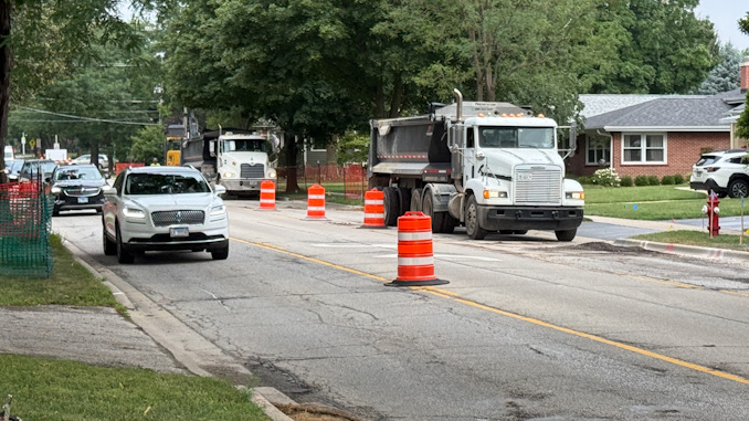 Dump trucks parked eastbound in the westbound lane of Euclid Avenue Monday morning, August 11, 2025 (CARDINAL NEWS)