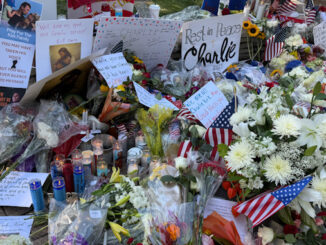 Flowers and candles at the Charlie Kirk vigil at North School Park in Arlington Heights on Sunday, September 14, 2025 (CARDINAL NEWS)