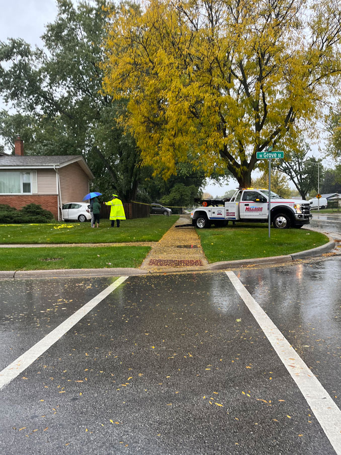 Small white cross over SUV crashed into a house at Wilke Road and Grove Street in Arlington Heights, Sunday, October 19, 2025 (SOURCE: Provided to CARDINAL NEWS via the "FASTEST/EASIEST" FORM on the CARDINAL NEWS NOTIFY PANEL)