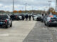 Metra police and Arlington Heights police surround a vehicle in the Metra Arlington Park parking lot where a woman underneath a vehicle was in a standoff after stabbing a Metra police officer (CARDINAL NEWS)