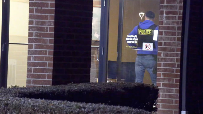 Arlington Heights police officers in the lobby of a Dana Point Condominiums building at 1515 East Central Road in Arlington Heights where two men were found dead in a utility room Friday night, November 21, 2025 (CARDINAL NEWS/CapturedNews)