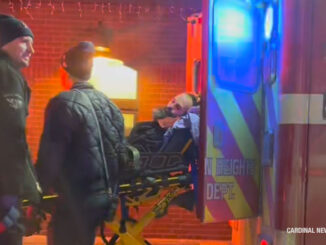 Bearded man loaded into an Arlington Heights Fire Department ambulance at the Metra train station, 45 West Northwest Highway, Arlington Heights (provided image/CARDINAL NEWS)