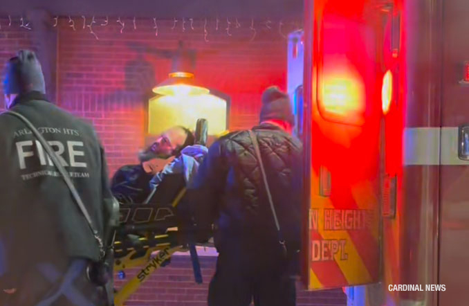 Bearded man loaded into an Arlington Heights Fire Department ambulance at the Metra train station, 45 West Northwest Highway, Arlington Heights (provided image/CARDINAL NEWS)