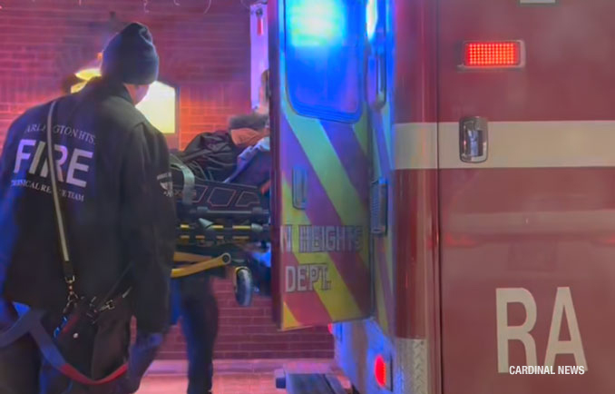 Bearded man loaded into an Arlington Heights Fire Department ambulance at the Metra train station, 45 West Northwest Highway, Arlington Heights (provided image/CARDINAL NEWS)
