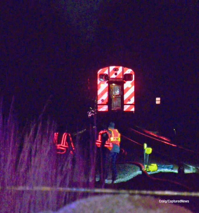 A train stopped at the scene that did not hit the person lying between the rails of the railroad track in Libertyville (Craig/CapturedNews)