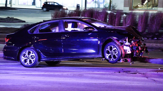 Signficantly damaged dark blue sedan after a personal injury crash at Palatine Road and Rand Road in Arlington Heights on Friday night February 13, 2026 (CARDINAL NEWS)