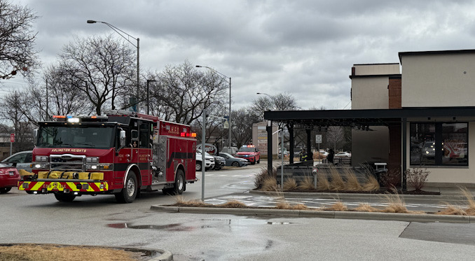 Arlington Heights Fire Department Engine 2 sits outside in the front of Raising Cane's while firefighters check out the interior of Raising Cane's restaurant, 225 East Palatine Road in Arlington Heights (CARDINAL NEWS)