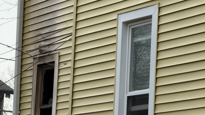 Exterior damage to the siding and the window frame near the kitchen fire that was at the rear the house on Pine Avenue near mine) Street in Arlington Heights on Wednesday, March 4, 2026 (CARDINAL NEWS)