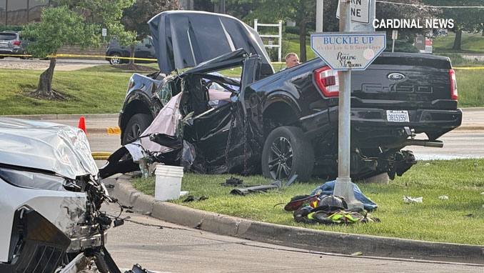 BMW in the foreground and pickup truck in the background at Algonquin Road and Magnolia Drive Rolling Meadows (CARDINAL NEWS)