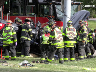 A large of force of firefighters from Rolling Meadows, Palatine, Schaumburg and Arlington Heights working to extricate a crash victim from pickup truck on Tuesday, May 26, 2026 (CARDINAL NEWS)