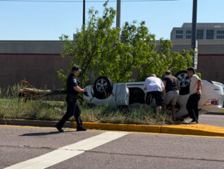 White sedan rolled over near the median on Algonquin Road at the main entrance to Lowe's, 990 West Algonquin Road in Arlington Heights on Sunday, May 24, 2026 at 3:52 p.m. (CARDINAL NEWS)